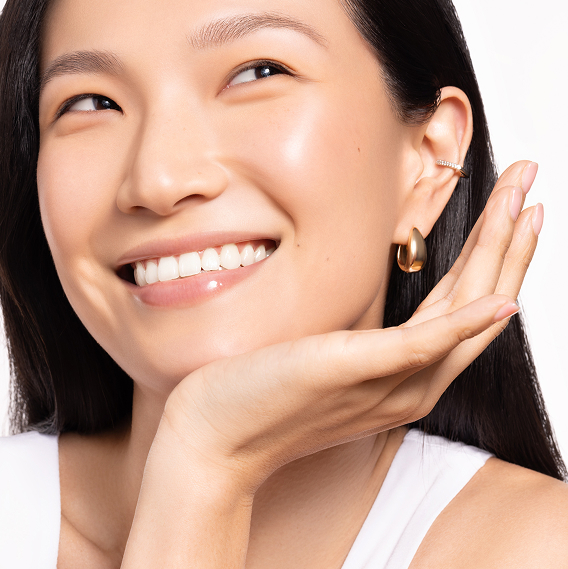Smiling model with glowing skin — Korean skincare quiz